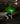 Black and white dog wearing a bright green light up dog collar for enhanced safety and visibility during nighttime walks.